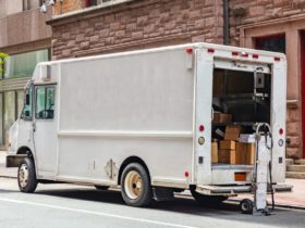 White color truck delivering packages, Manhattan downtown